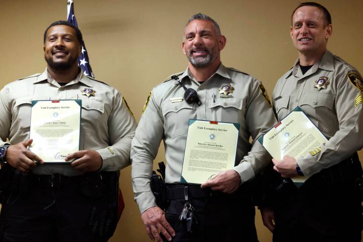 The Unit Exemplary Service award recipients, Metro detectives Roger Gillum, left, Manuel Botelh ...