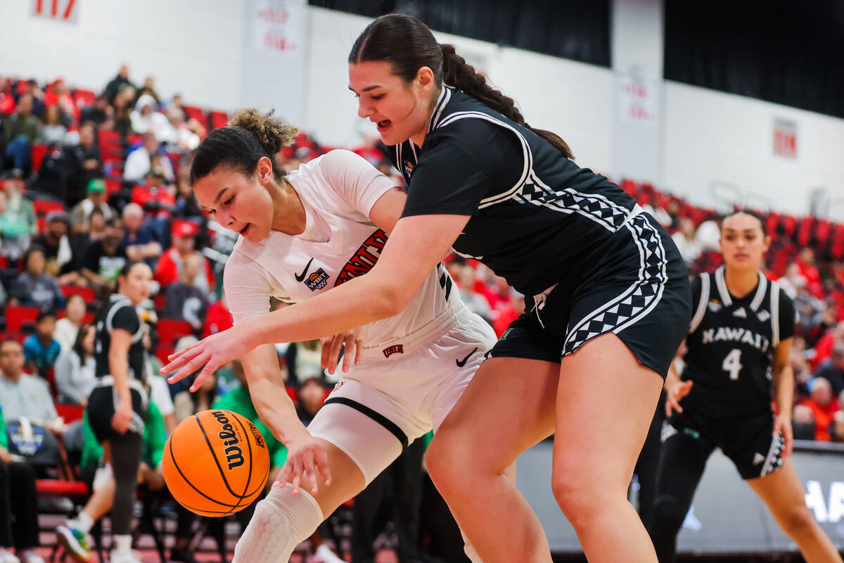 Lady Rebels forward McKinna Brackens (21) reaches or the ball as it escapes her grip during a W ...