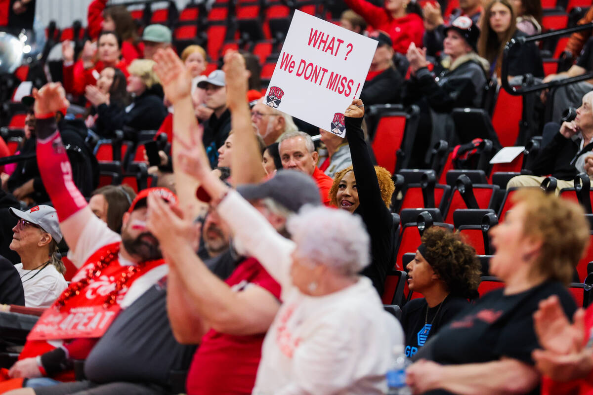 A Lady Rebels fan cheers during a Women's Basketball Invitation Tournament game between the Lad ...