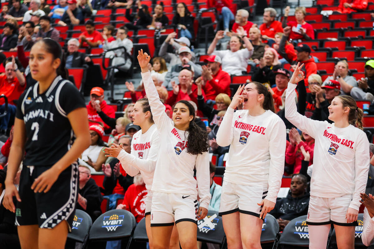 The Lady Rebels bench cheers during a Women's Basketball Invitation Tournament game between the ...