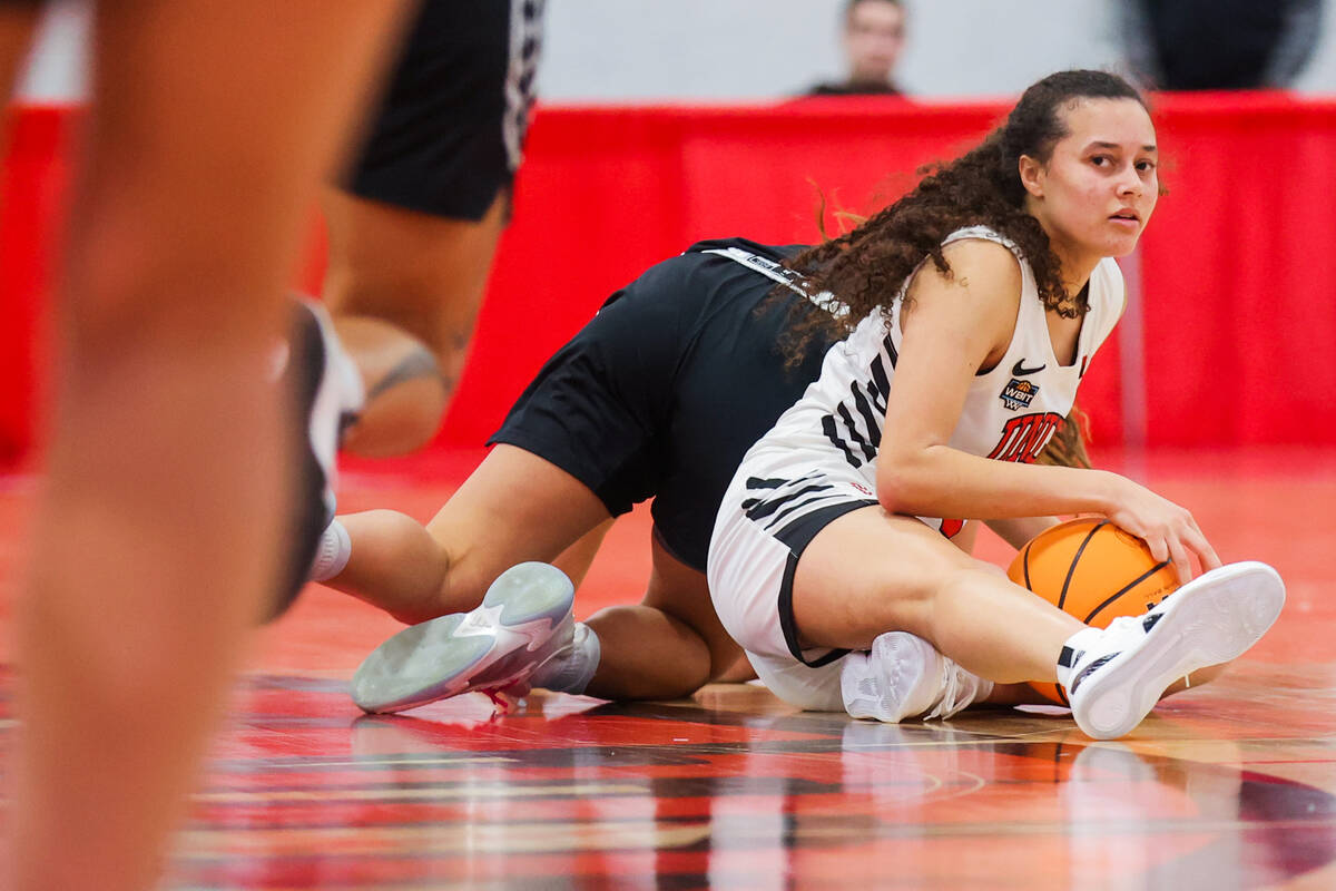 Lady Rebels guard Kiara Jackson (3) eyes the referee after a scuffle during a Women's Basketbal ...