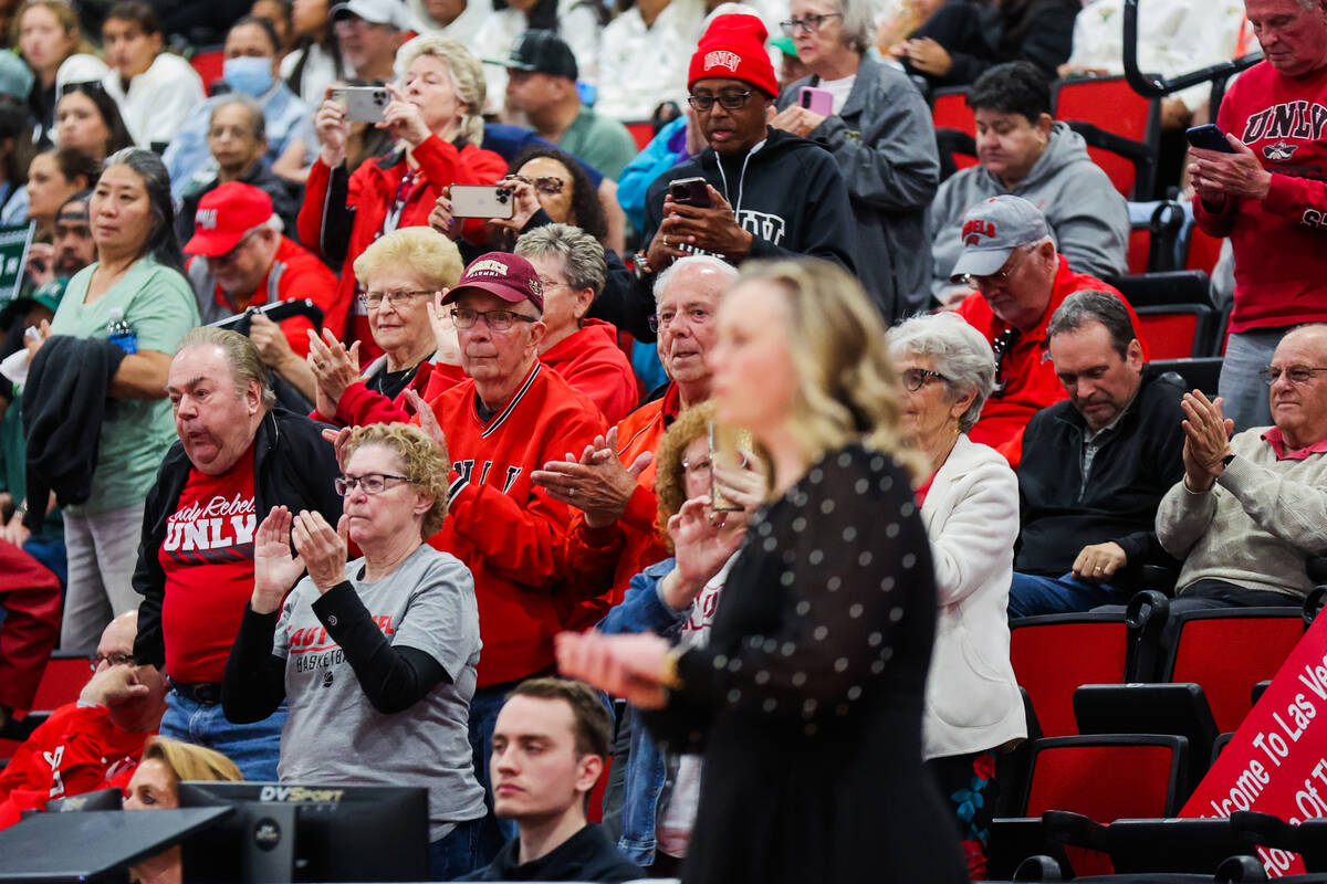 Lady Rebels fans cheer behind head coach Lindy La Rocque during a Women's Basketball Invitation ...