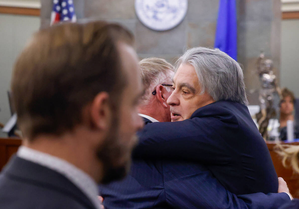 Attorneys Robert Eglet, center, and William Kemp, representing plaintiffs in a lawsuit against ...
