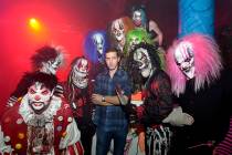 Jason Egan, owner of Fright Dome, center, is shown with some of the clowns at the haunted house ...