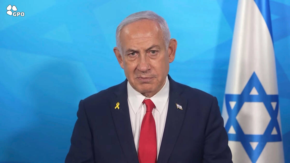 In this image made from a video released by the Israeli Government Press Office, Prime Minister ...