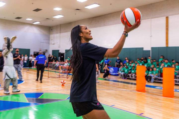 Aces star A'ja Wilson readies to lay in a basketball for a score as she demonstrates a skills c ...