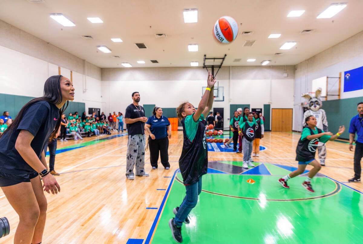 Aces star A'ja Wilson cheers on kids while they compete in a skills challenge as the A'ja Wilso ...