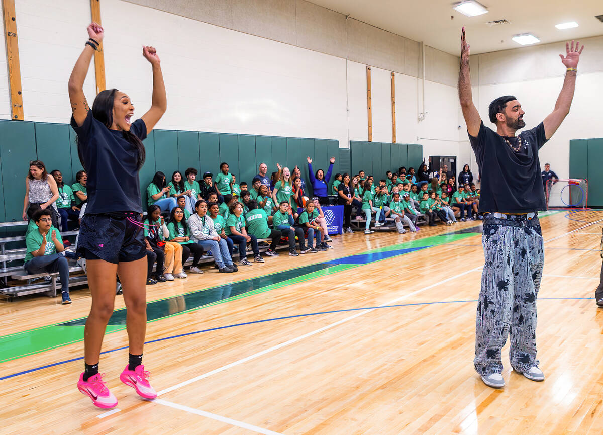 Aces star A'ja Wilson and Ronnie 2K cheer on kids while they compete in a skills challenge as t ...