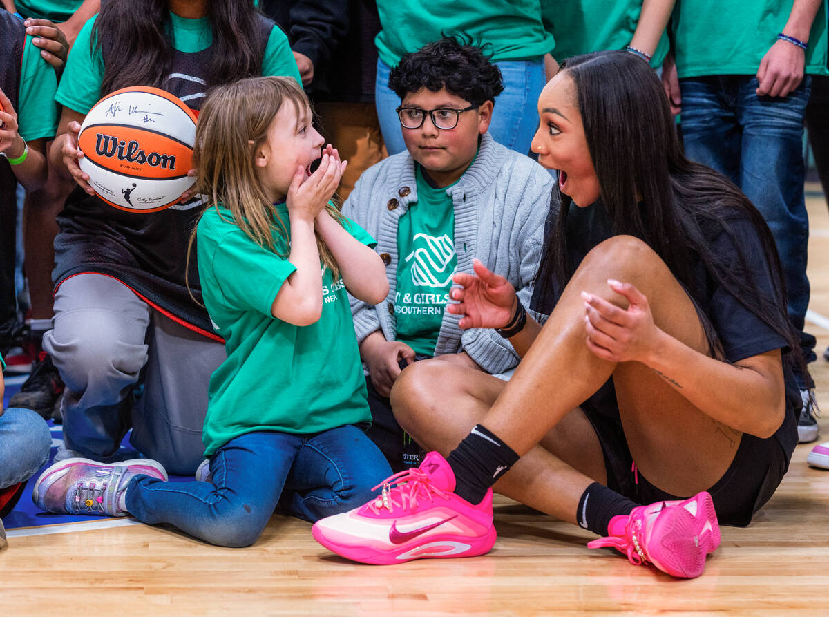 Aces A'ja Wilson and Kaleesa Baker, 8, are amazed at her new Nike A’One signature shoes as th ...