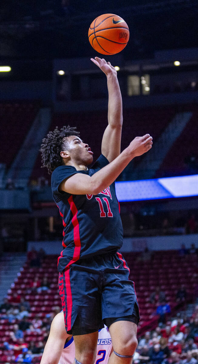UNLV guard Dedan Thomas Jr. (11) lays in a basket against the Boise State Broncos during the se ...