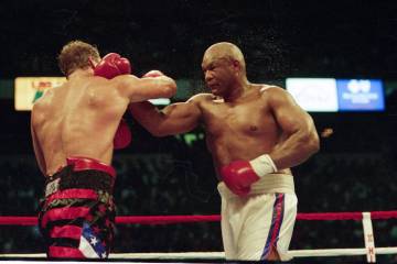 Heavyweight boxing match between Tommy Morrison and George Foreman for the vacant World Boxing ...