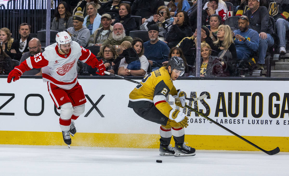 Golden Knights defenseman Zach Whitecloud (2) chases down a puck as Detroit Red Wings right win ...