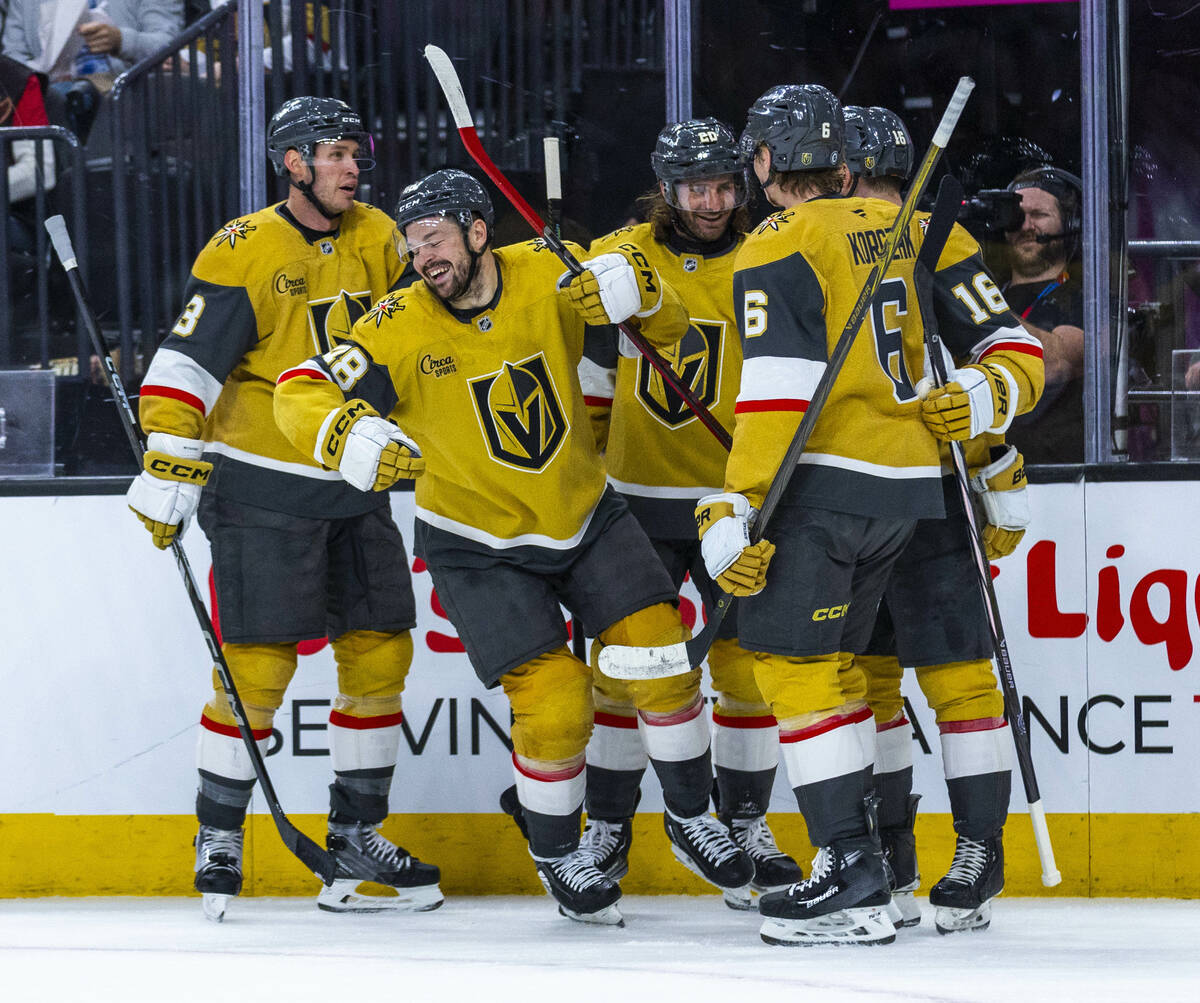 Golden Knights players celebrate a goal against the Detroit Red Wings during the first period o ...
