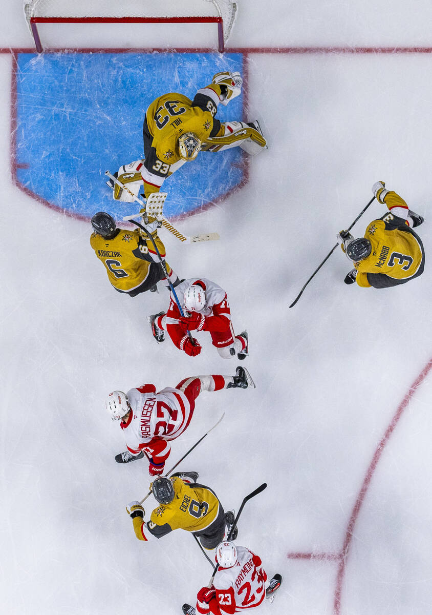 The puck hits Detroit Red Wings right wing Vladimir Tarasenko (11) on its way to Golden Knights ...