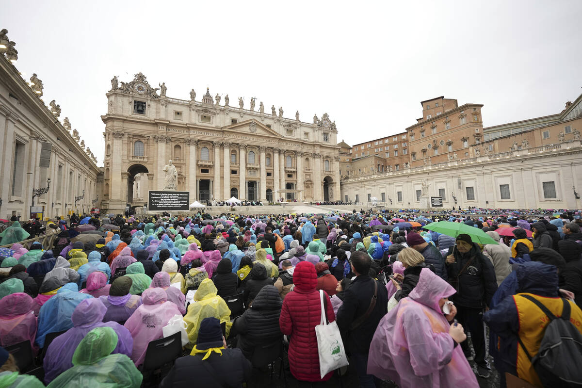 Participants in a mass for the jubilar pilgrims from Naples wait for the start of the celebrati ...