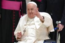 FILE - Pope Francis waves as he arrives for his weekly general audience in the Paul VI Hall, at ...