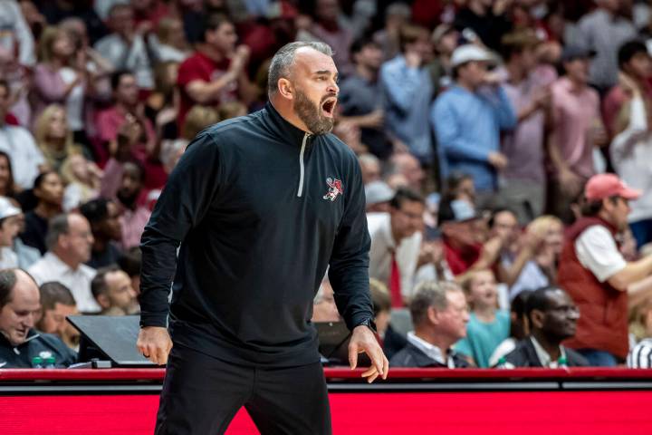 Arkansas State head coach Bryan Hodgson works with his team during the second half of an NCAA c ...