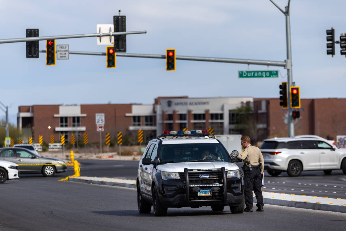 Officers speak to each other as they keep part of Patrick Lane closed off pending an investigat ...