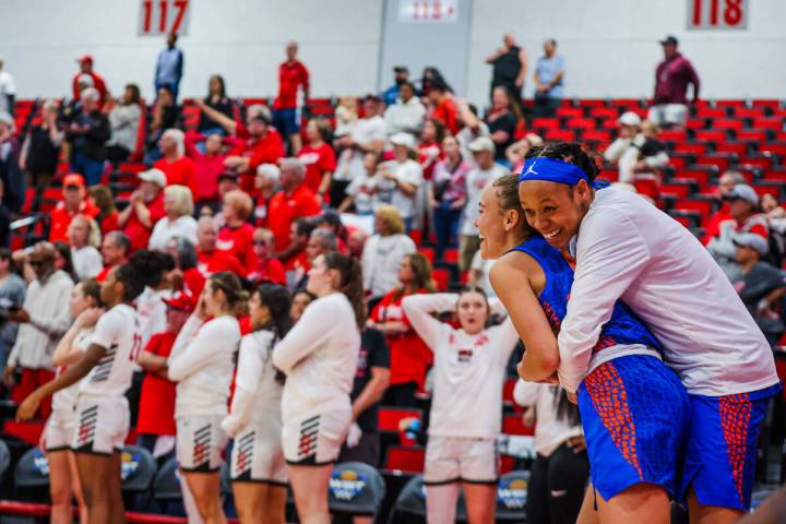 Florida Gators teammates celebrate beating the Lady Rebels on a buzzer beater during a second r ...