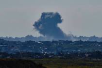 Smoke rises to the sky after an explosion in the Gaza Strip as seen from southern Israel, Sunda ...