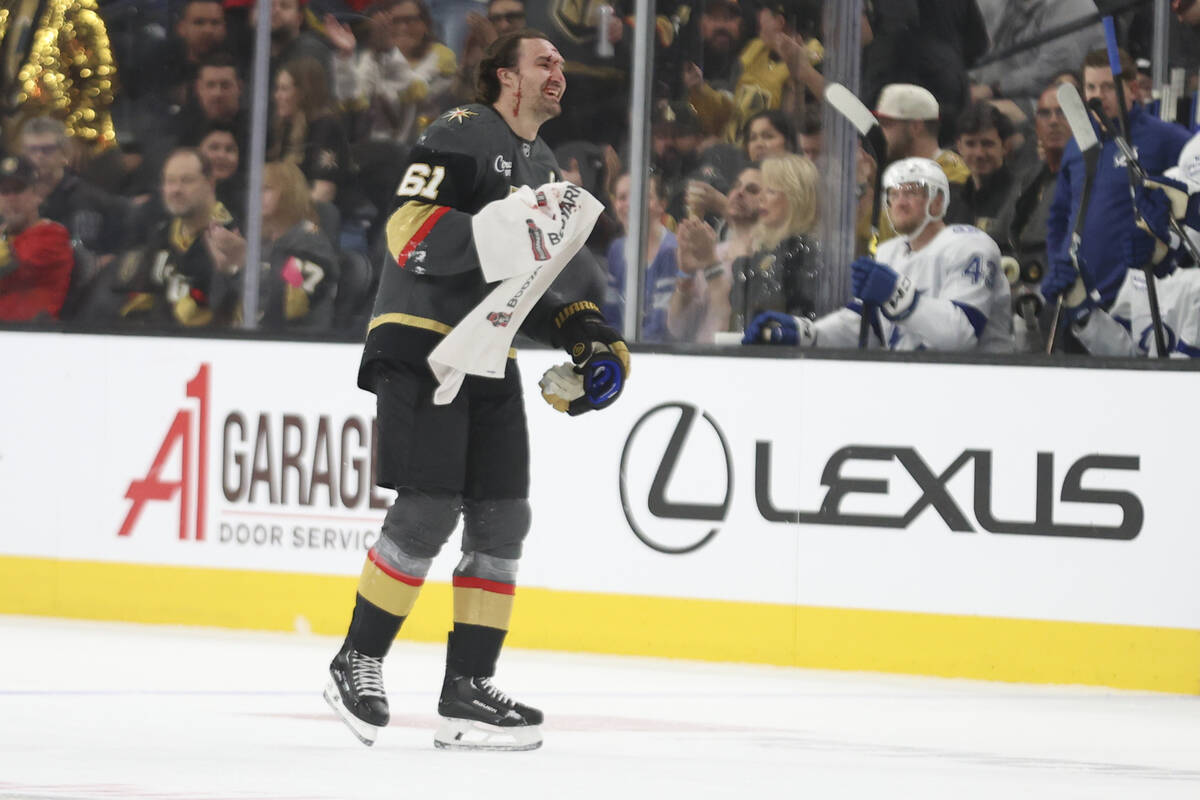 Vegas Golden Knights right wing Mark Stone (61) leaves the ice after being hit in the head with ...