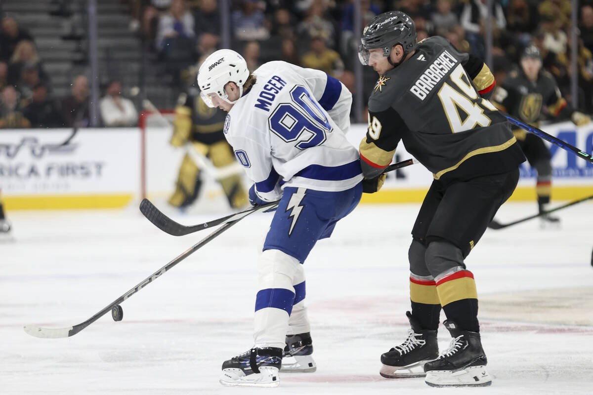 Tampa Bay Lightning defenseman J.J. Moser (90) and Vegas Golden Knights center Ivan Barbashev ( ...