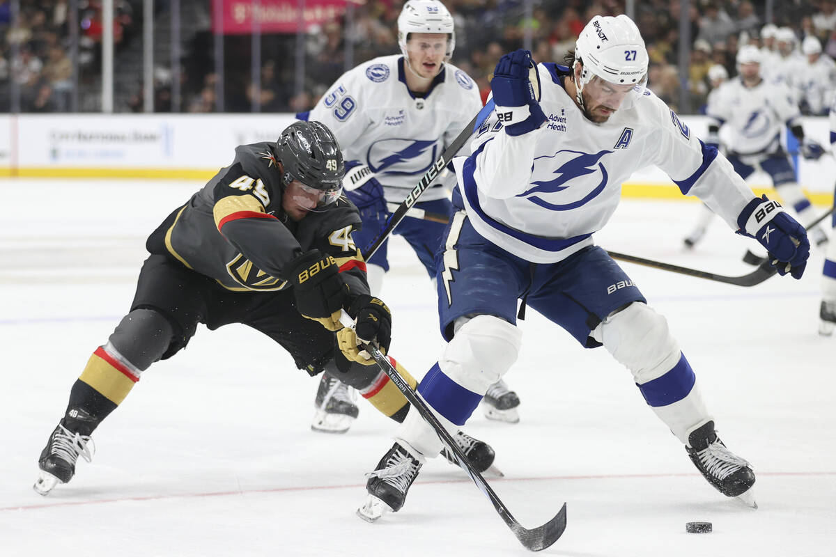 Vegas Golden Knights center Ivan Barbashev (49) and Tampa Bay Lightning defenseman Ryan McDonag ...