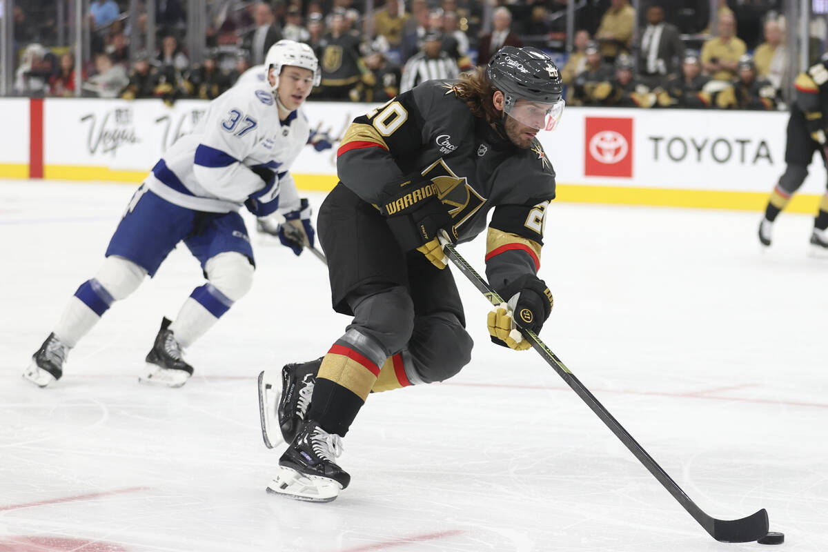 Vegas Golden Knights left wing Brandon Saad (20) skates past Tampa Bay Lightning center Yanni G ...