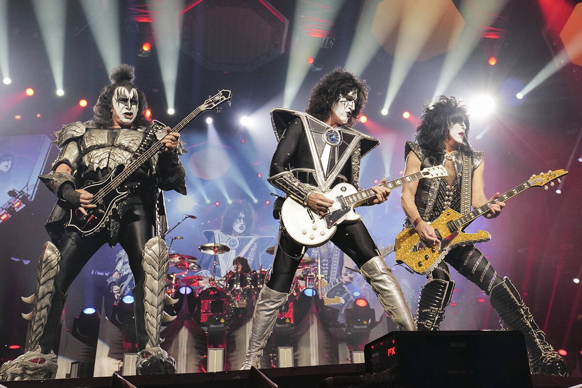 Gene Simmons, left, Tommy Thayer, Paul Stanley of KISS perform during the final night of the &q ...