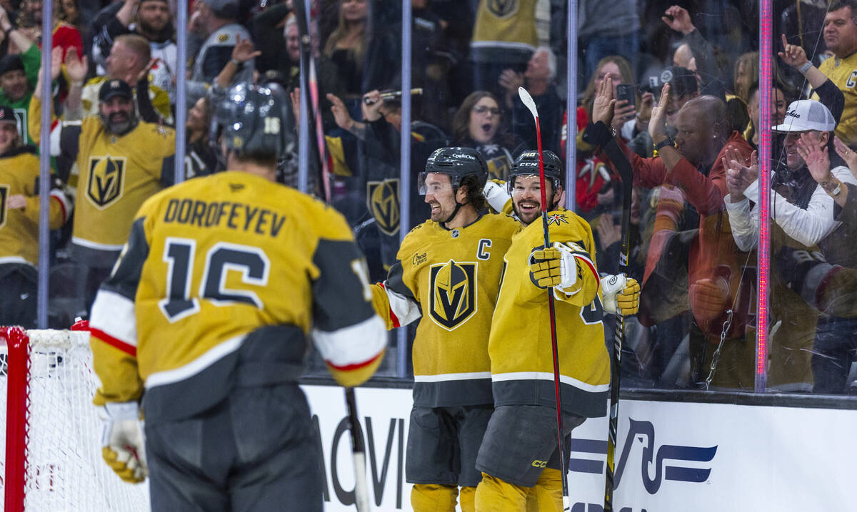 Golden Knights right wing Mark Stone (61) and center Tomas Hertl (48) celebrate his goal agains ...