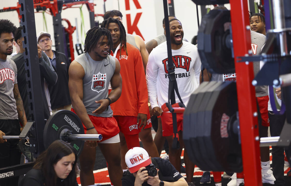 UNLV players cheer each other on during the bench press at UNLV football's Pro Day at the Ferti ...