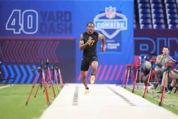 UNLV wide receiver Ricky White runs the 40-yard dash at the NFL football scouting combine in In ...