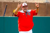 Longtime Las Vegas High coach Sam Thomas signals a player at first base during their state base ...