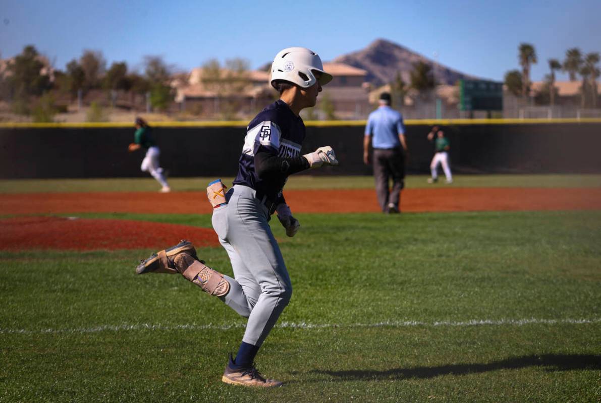 Shadow Ridge's Oliver Schoppmann runs to first base during a baseball game at Palo Verde High S ...