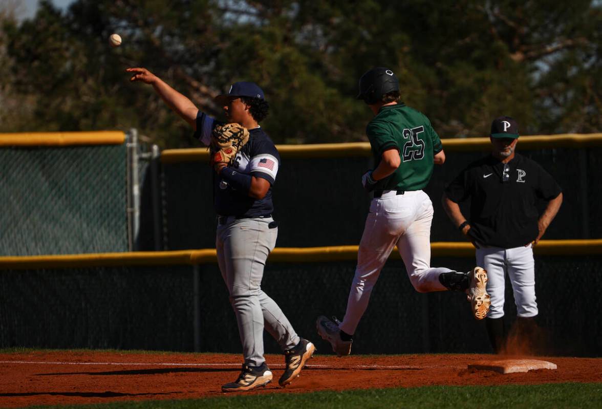 Palo Verde's Ethan Clauss (25) gets tagged out by Shadow Ridge's Giovanni Galvan during a baseb ...