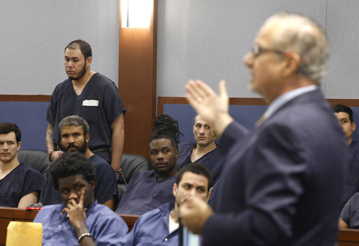 William Costa, left, who is accused of kidnapping a construction company owner, listens as his ...