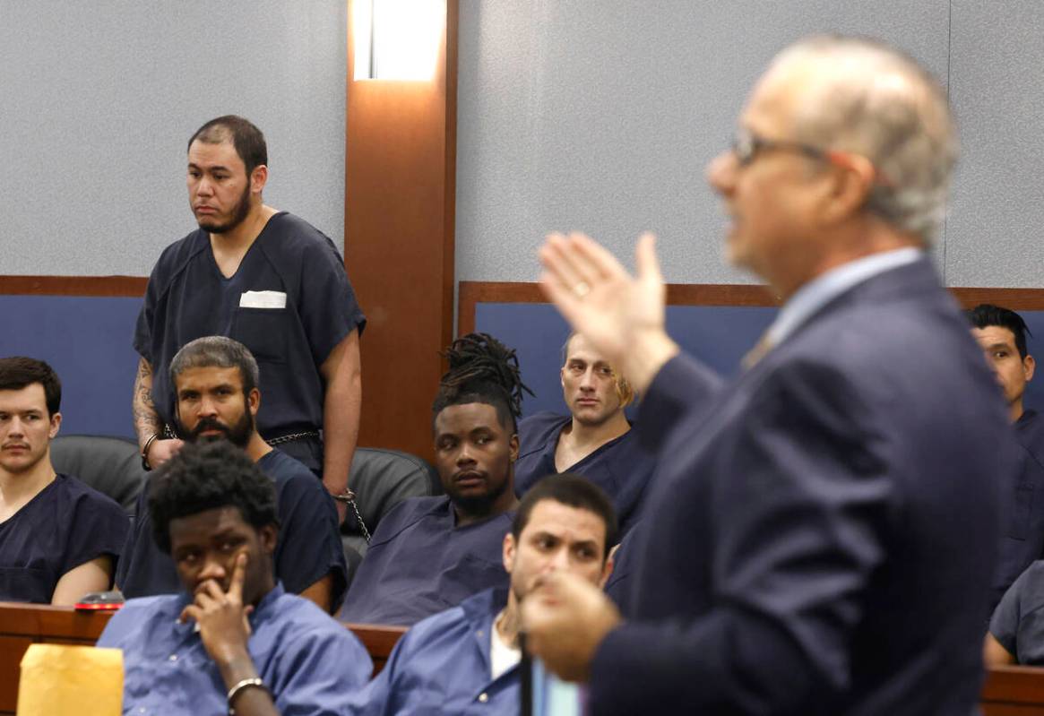William Costa, left, who is accused of kidnapping a construction company owner, listens as his ...