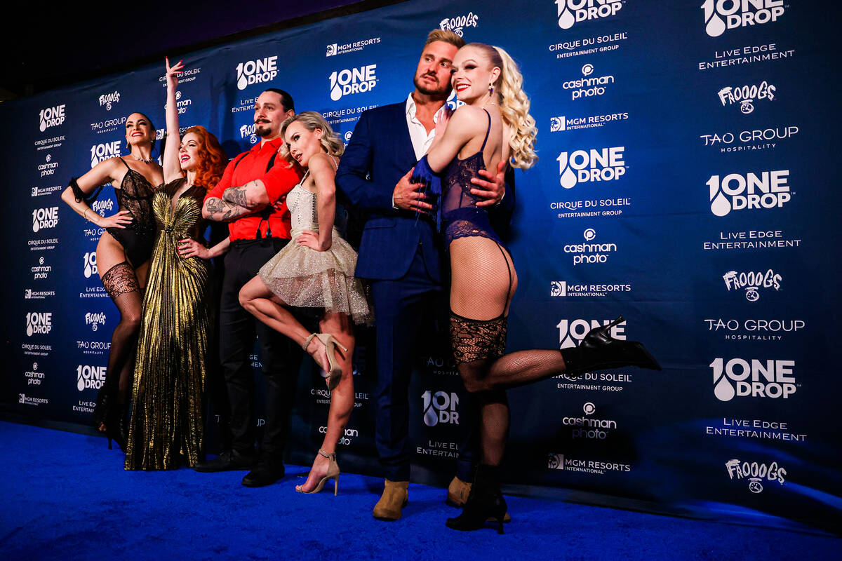 Various event performers pose on the blue carpet at the One Night for One Drop event hosted by ...
