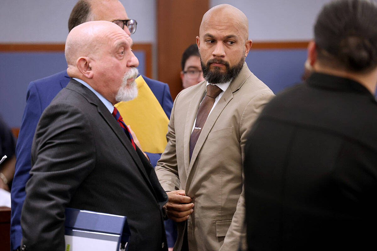 Metropolitan Police Department Sgt. Kevin Menon, right, appears in court with his attorney Domi ...