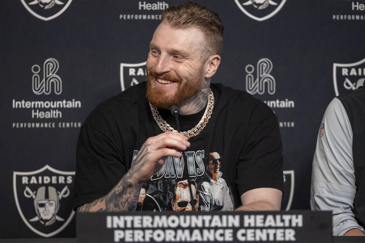 Raiders defensive end Maxx Crosby smiles during a news conference after receiving a contract ex ...