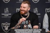 Raiders defensive end Maxx Crosby smiles during a news conference after receiving a contract ex ...