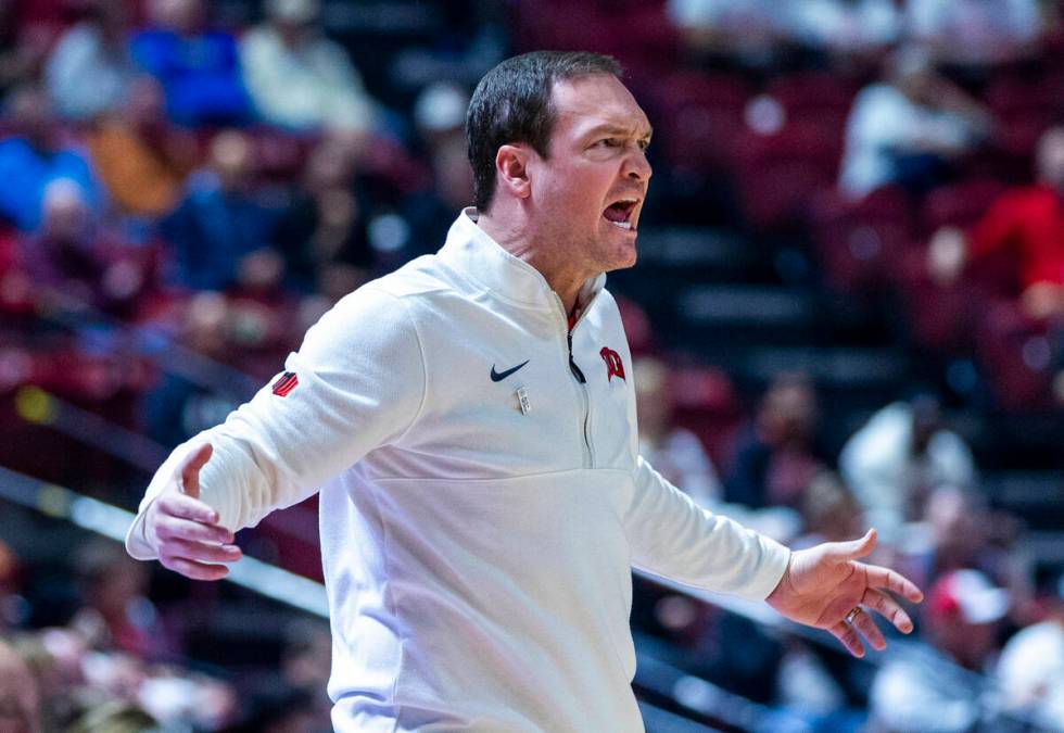 UNLV head coach Kevin Kruger is angry after a lack of foul calling by officials against the San ...