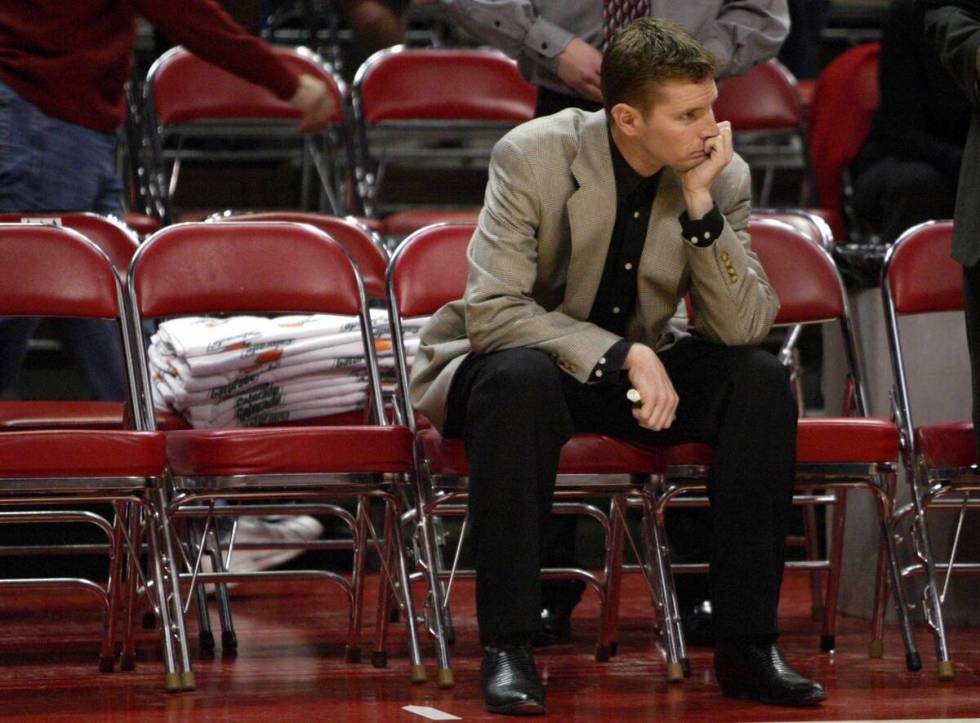 UNLV interim head basketball coach Jay Spoonhour sits on the bench during player introductions ...
