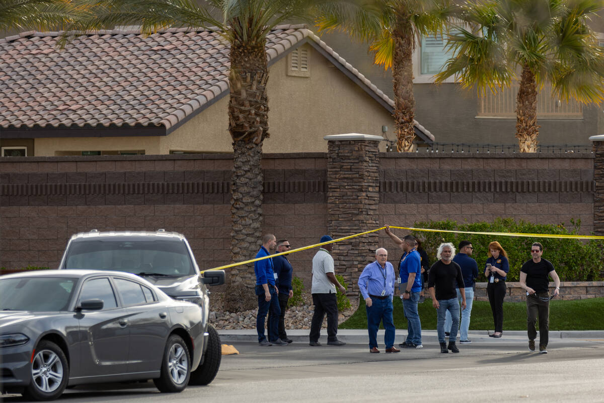 Investigators leave the scene of an officer-involved shooting in the Sunset Cove neighborhood o ...