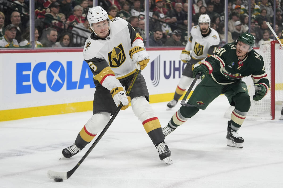 Vegas Golden Knights defenseman Kaedan Korczak (6) skates with the puck as Minnesota Wild cente ...
