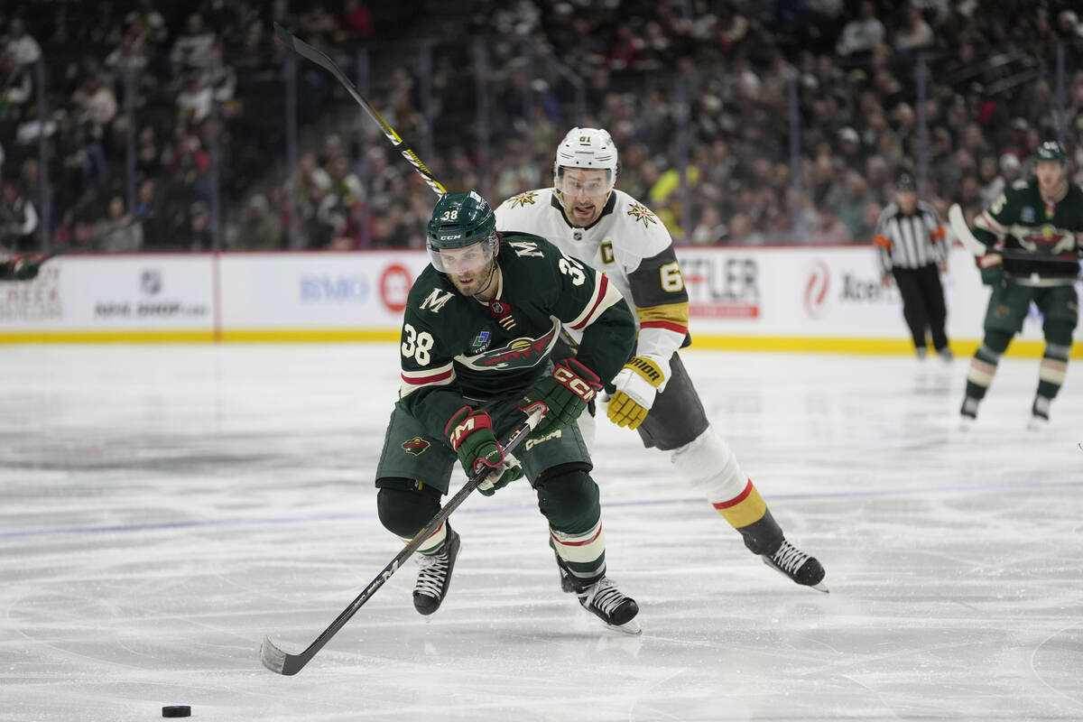 Minnesota Wild right wing Ryan Hartman (38) skates toward the puck as Vegas Golden Knights righ ...