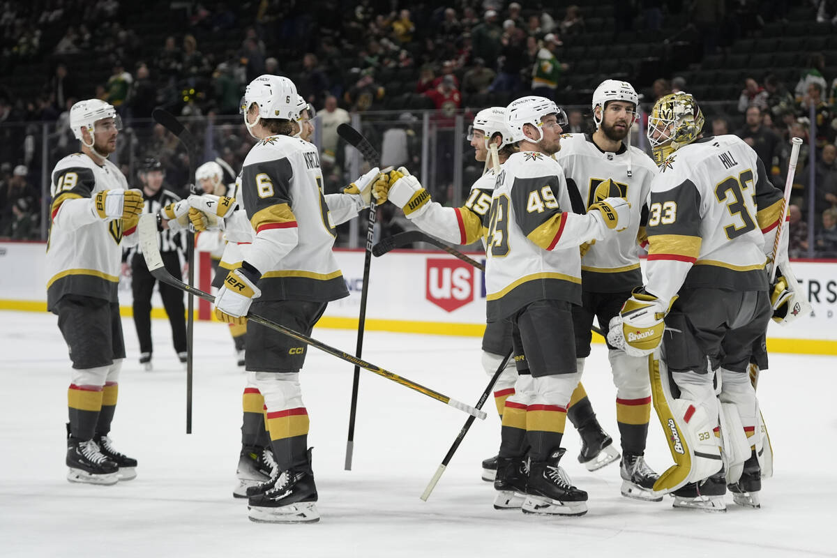 Vegas Golden Knights goaltender Adin Hill (33) celebrates with teammates after the 5-1 win agai ...
