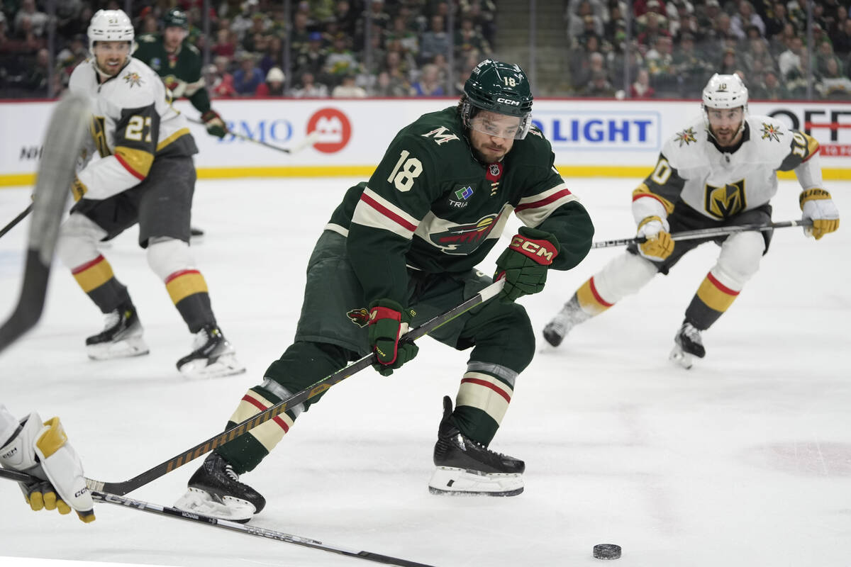 Minnesota Wild center Vinnie Hinostroza (18) skates with the puck during the first period of an ...