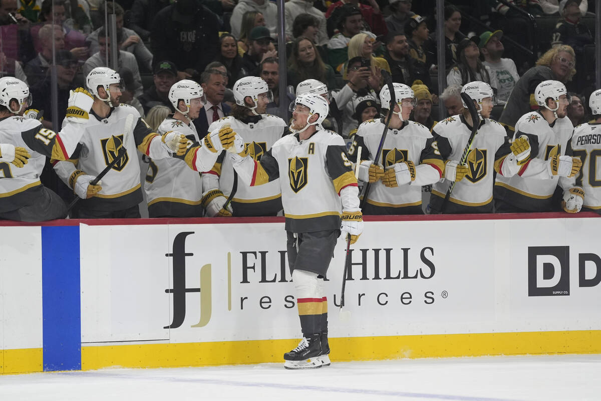 Vegas Golden Knights center Jack Eichel (9) celebrates with teammates after scoring a goal duri ...