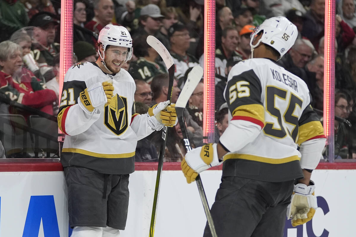 Vegas Golden Knights center Brett Howden (21) celebrates with right wing Keegan Kolesar (55) af ...